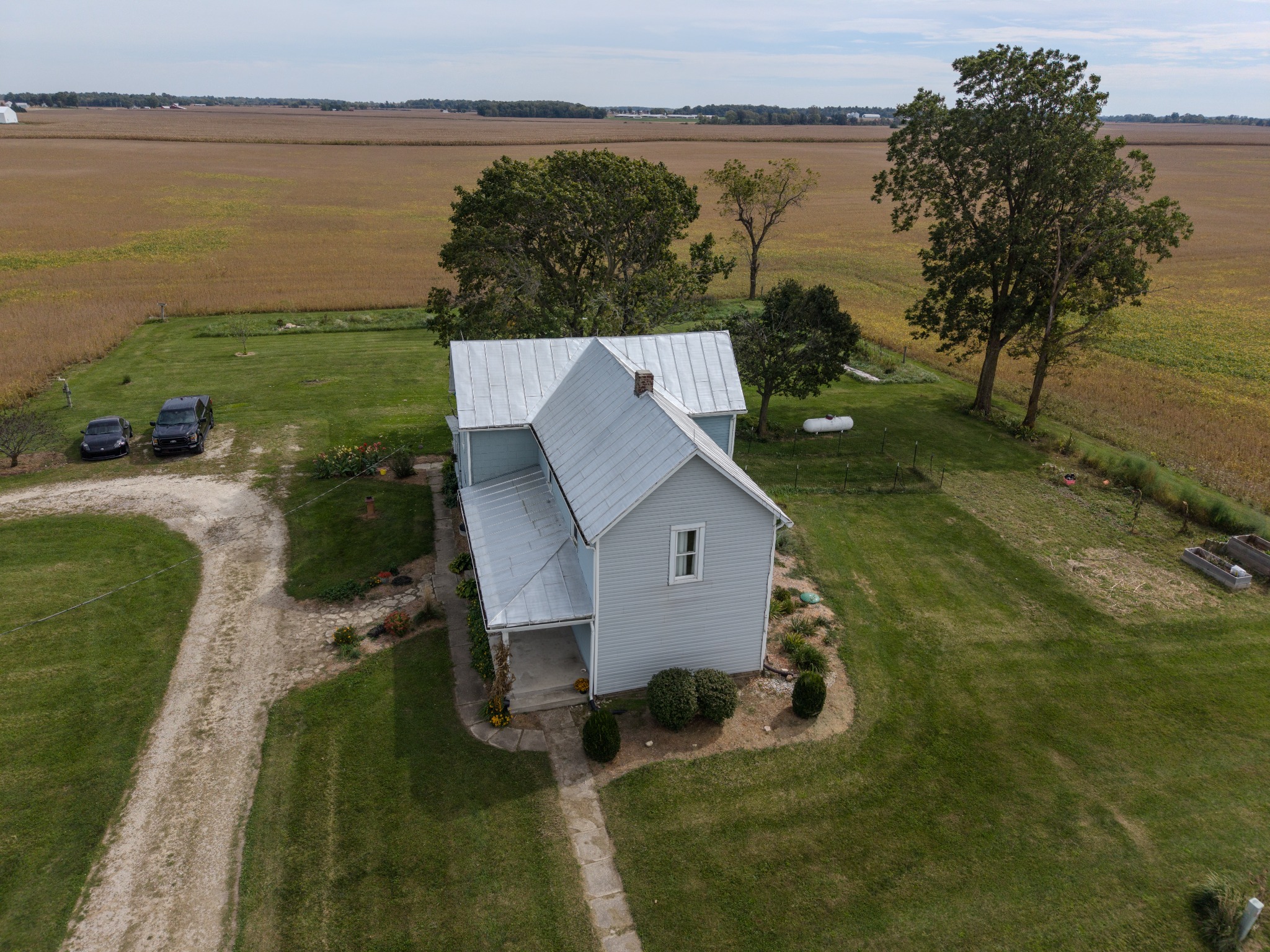 Aerial photograph of a rural home surrounded by open fields
